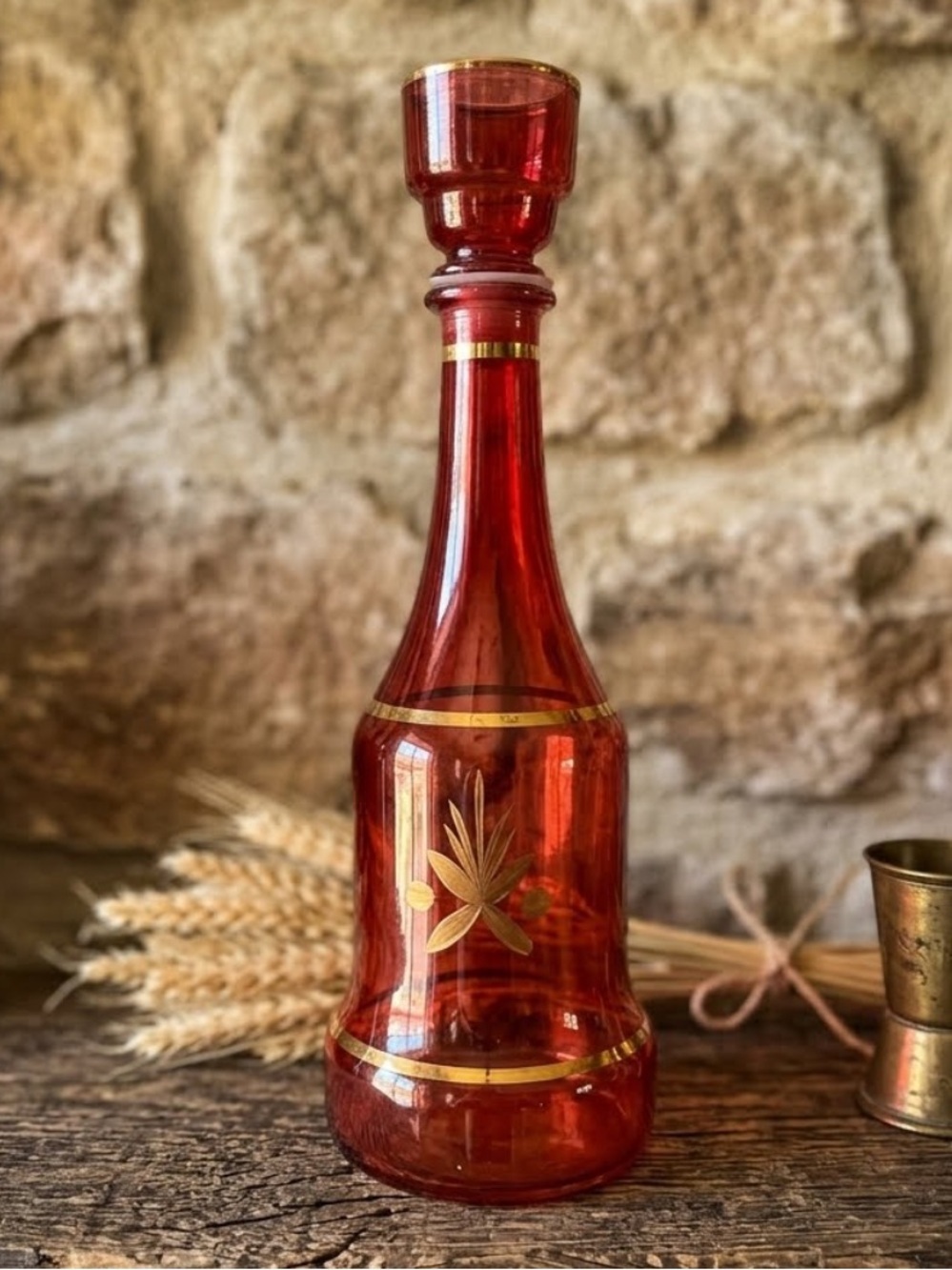 Vintage red cranberry glass decanter
gold wheat pattern
gold rim detailing